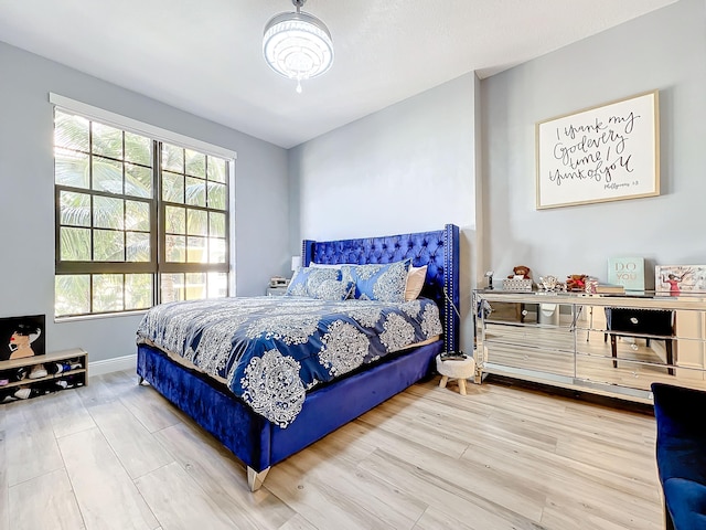 bedroom with hardwood / wood-style flooring