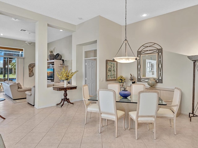 dining area featuring ceiling fan and light tile patterned floors