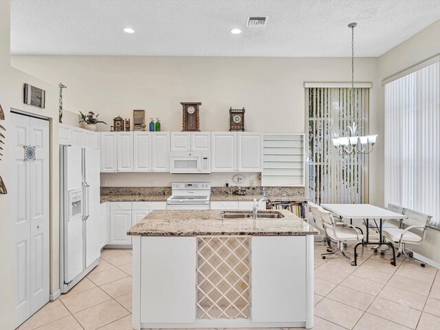 dining room with a textured ceiling and light tile patterned floors