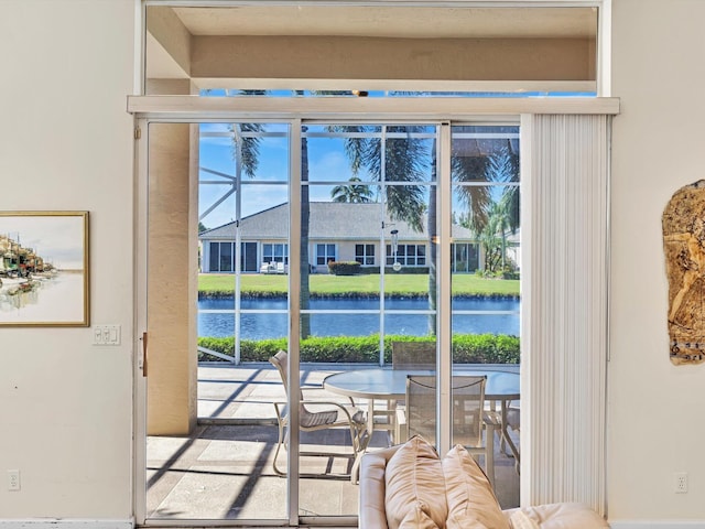 doorway to outside featuring a water view