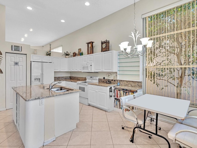 kitchen featuring pendant lighting, sink, white appliances, white cabinetry, and an inviting chandelier