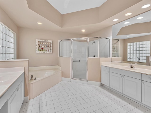 bathroom featuring vanity, plus walk in shower, and tile patterned floors