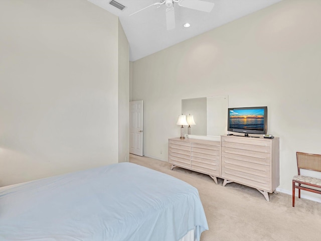 bedroom featuring ceiling fan, light carpet, and high vaulted ceiling