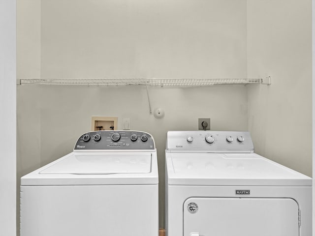 washroom featuring independent washer and dryer