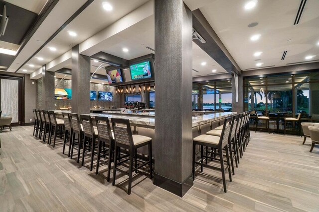 carpeted dining room featuring a tray ceiling