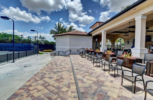 dining space with a raised ceiling