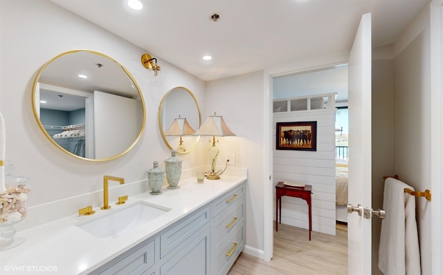 bathroom with vanity and hardwood / wood-style floors