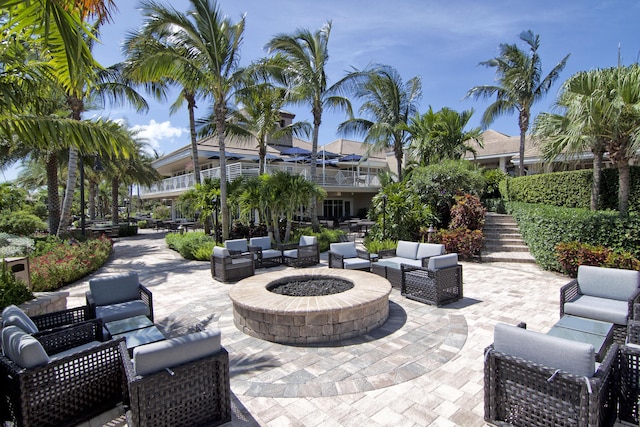 view of patio featuring an outdoor living space with a fire pit