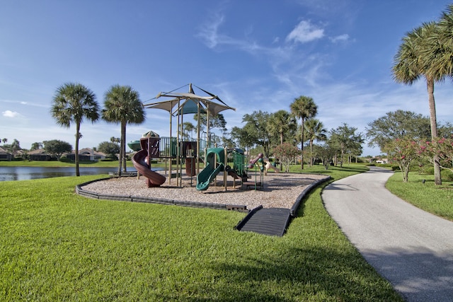 view of jungle gym featuring a yard and a water view