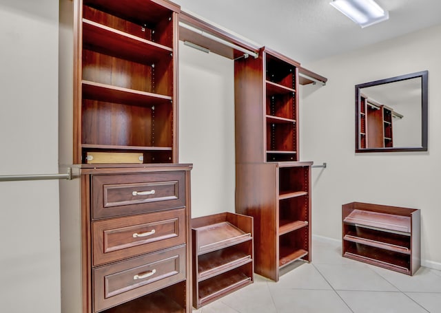 spacious closet featuring light tile patterned floors