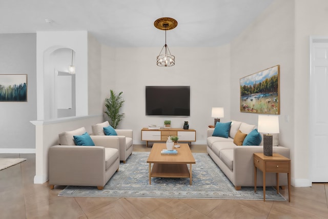 living room with an inviting chandelier