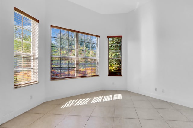 tiled empty room with plenty of natural light