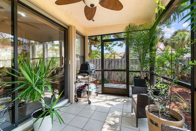 sunroom / solarium with ceiling fan