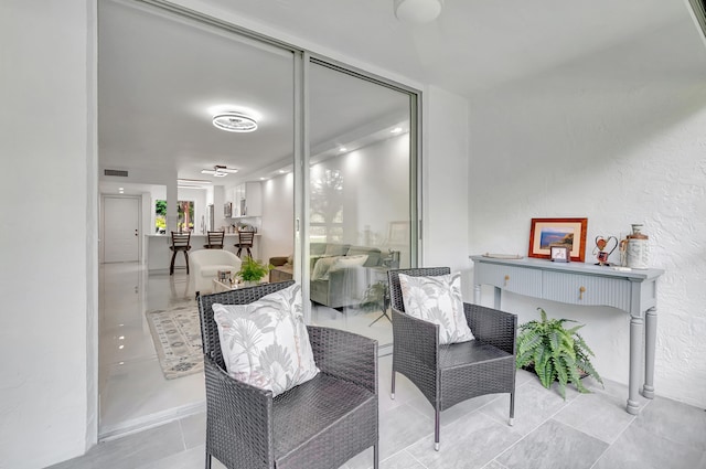 sitting room with light tile patterned floors