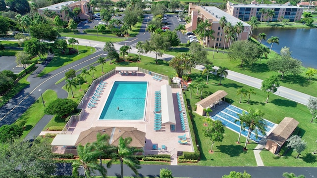 birds eye view of property with a water view