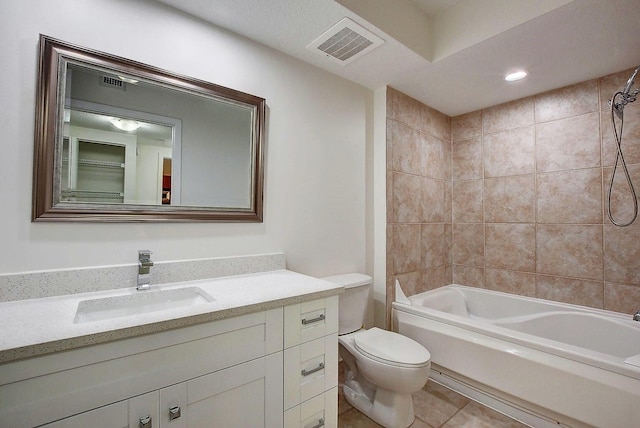 full bathroom featuring tiled shower / bath combo, tile patterned flooring, vanity, and toilet