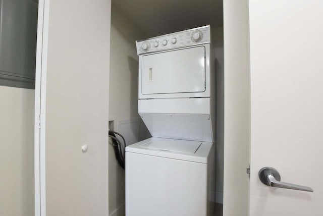 laundry area featuring stacked washer and dryer