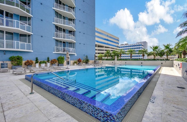 view of pool featuring a patio