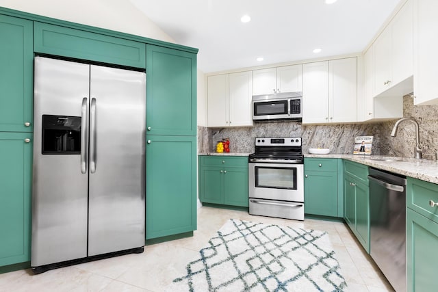 kitchen featuring sink, white cabinetry, green cabinetry, stainless steel appliances, and light stone counters