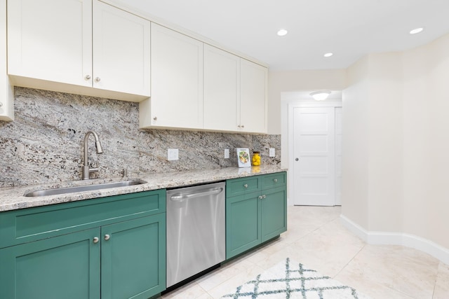 kitchen featuring white cabinets, dishwasher, decorative backsplash, sink, and light tile patterned floors