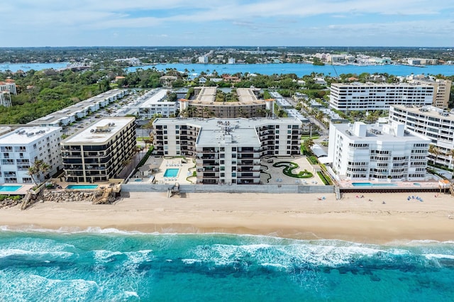 bird's eye view with a water view and a view of the beach