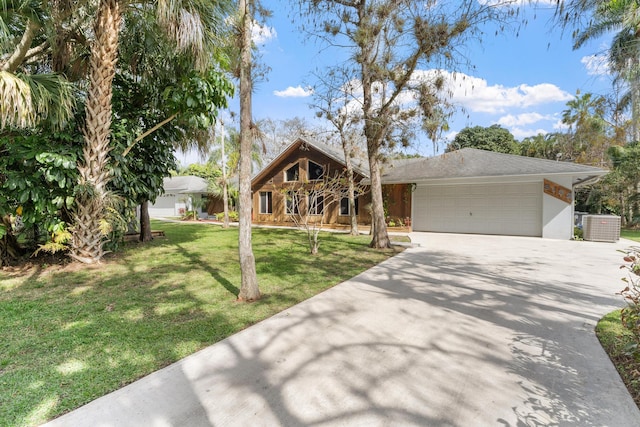 view of front facade featuring cooling unit, a front lawn, and a garage