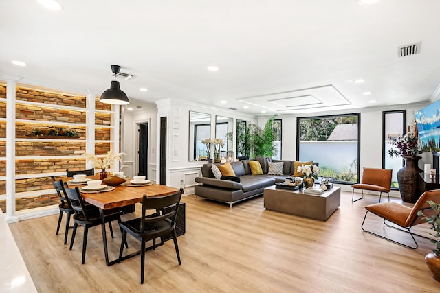 interior space featuring ornamental molding and light wood-type flooring