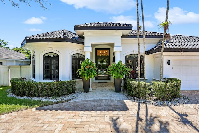 mediterranean / spanish house featuring a garage