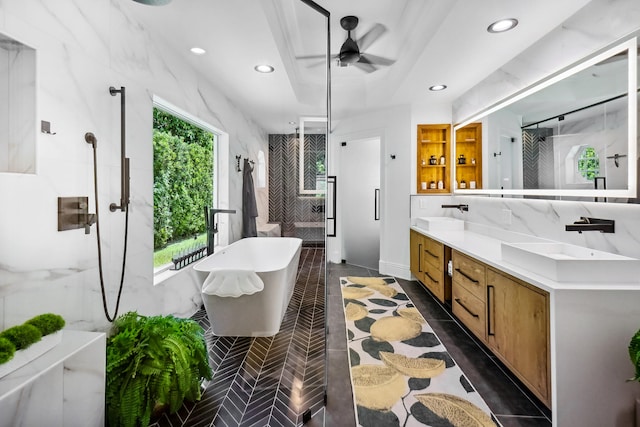 bathroom featuring ceiling fan, separate shower and tub, and vanity