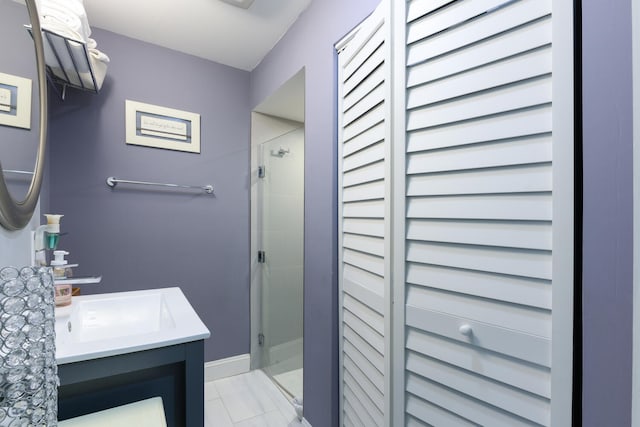 bathroom featuring vanity and an enclosed shower