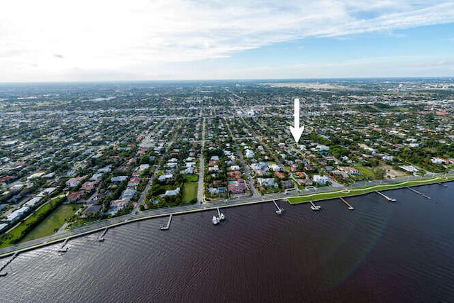 birds eye view of property featuring a water view