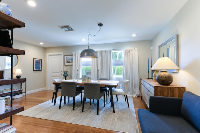 dining space featuring light wood-type flooring