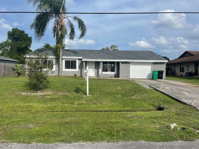 single story home with a garage and a front lawn