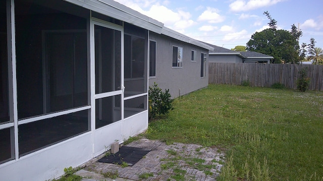 view of yard with a sunroom