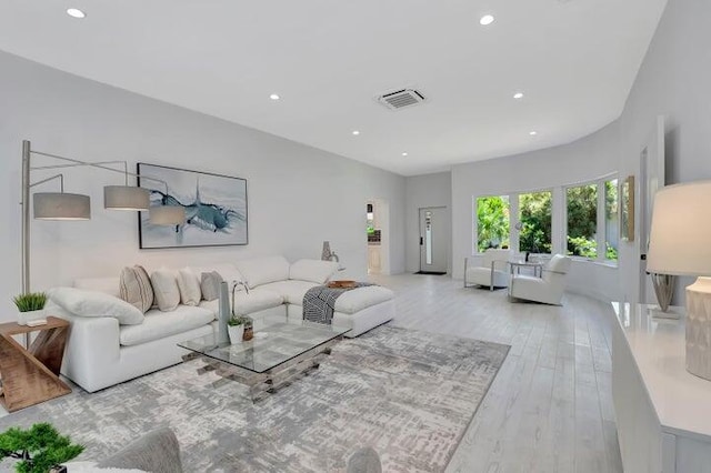 living room with light hardwood / wood-style floors