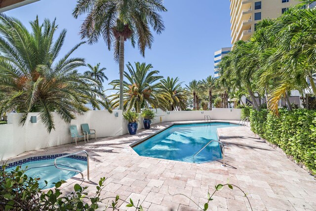 view of swimming pool featuring a patio