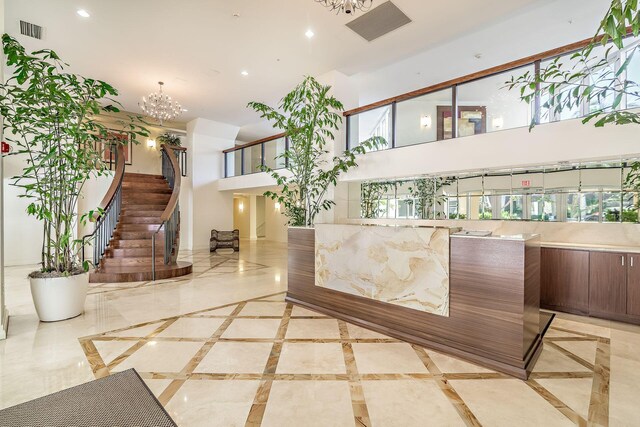 reception area featuring an inviting chandelier