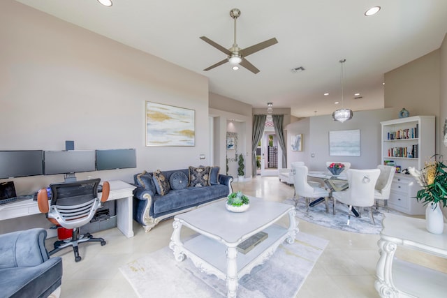 tiled living room with ceiling fan