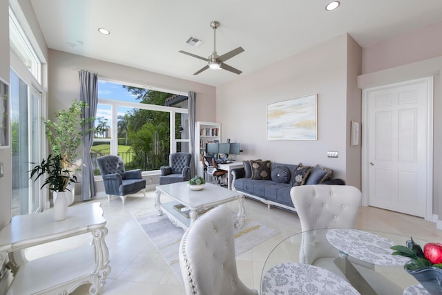 tiled living room with ceiling fan