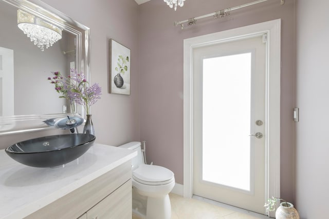 bathroom with tile patterned floors, vanity, and toilet