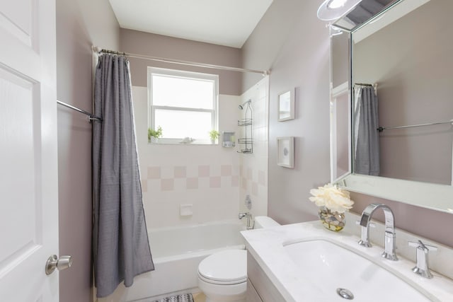 full bathroom featuring shower / bath combo, vanity, and toilet