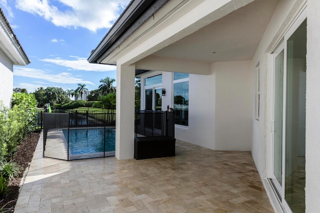 view of swimming pool featuring a patio