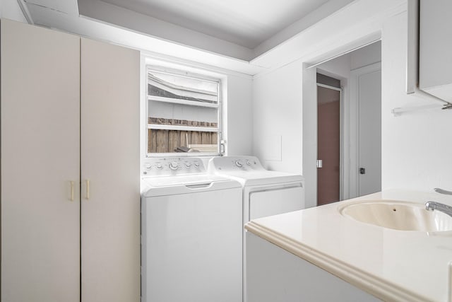 laundry room featuring separate washer and dryer and sink