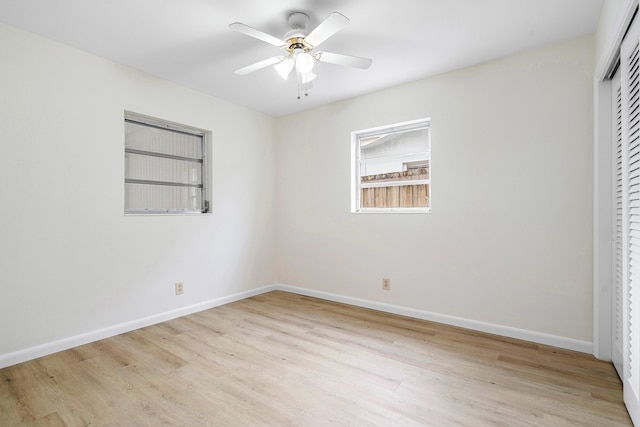 spare room featuring light hardwood / wood-style floors and ceiling fan