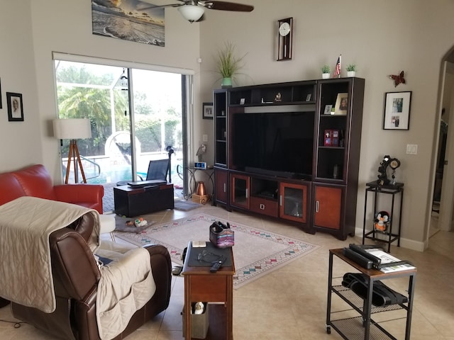 tiled living room with ceiling fan