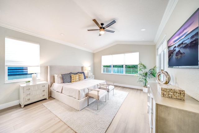 bedroom featuring light wood-type flooring, crown molding, vaulted ceiling, and ceiling fan