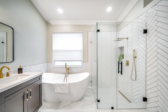 bathroom featuring ornamental molding, vanity, and separate shower and tub