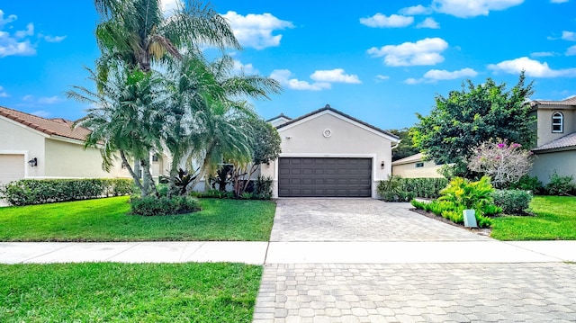 view of front facade with a front lawn and a garage