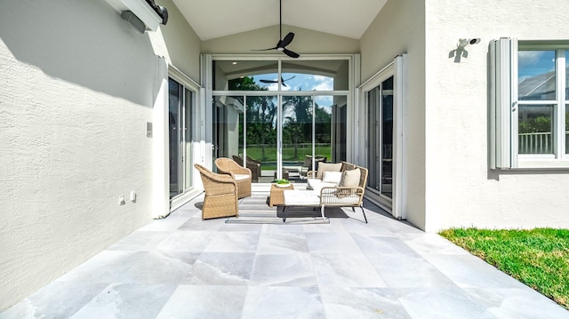 sunroom featuring vaulted ceiling and ceiling fan