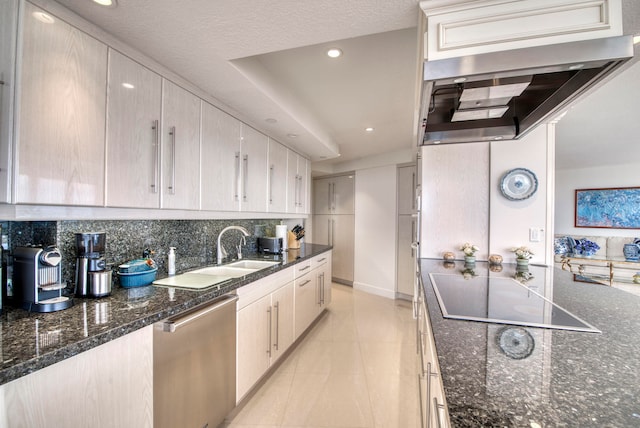 kitchen featuring decorative backsplash, black cooktop, dishwasher, dark stone counters, and sink